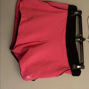 Nike pink and black athletic shorts